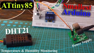 The image showcases a project using an ATtiny85 microcontroller, DHT21 temperature and humidity sensor, SSD1306 OLED display, and an Arduino board. The components are connected together to create a temperature and humidity monitoring system. The ATtiny85 microcontroller serves as the central controller, reading data from the DHT21 sensor and displaying it on the SSD1306 OLED display. The Arduino board provides power and facilitates communication between the components. The system offers a compact and efficient solution for monitoring temperature and humidity using the ATtiny85 and Arduino platform.