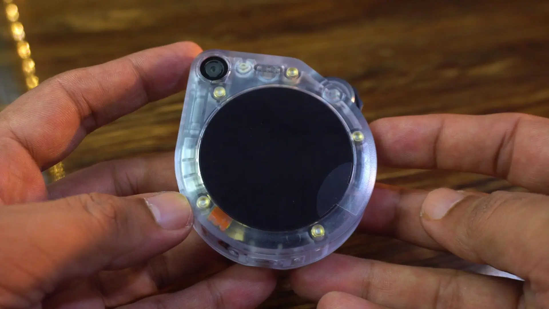 A close-up of the SenseCAP Watcher's screen showing the XiaoZhi AI is active.