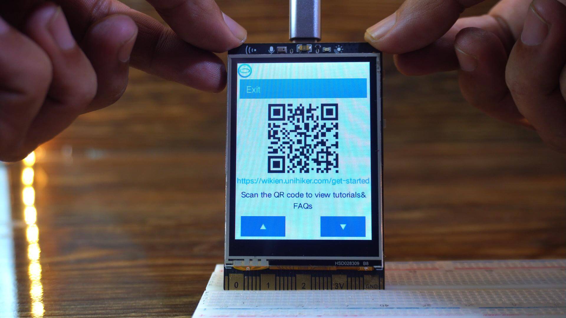 UNIHIKER M10 home menu with the Get Started option on the touchscreen