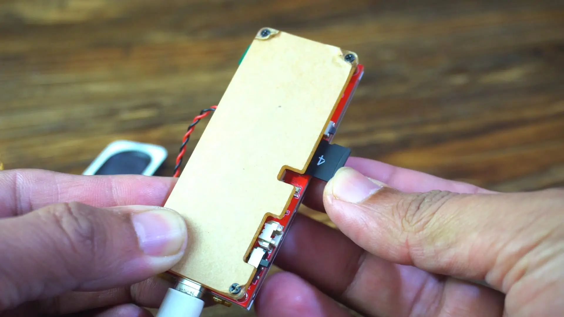 ESP32-S3 development board connected to a Micro SD card for audio file storage