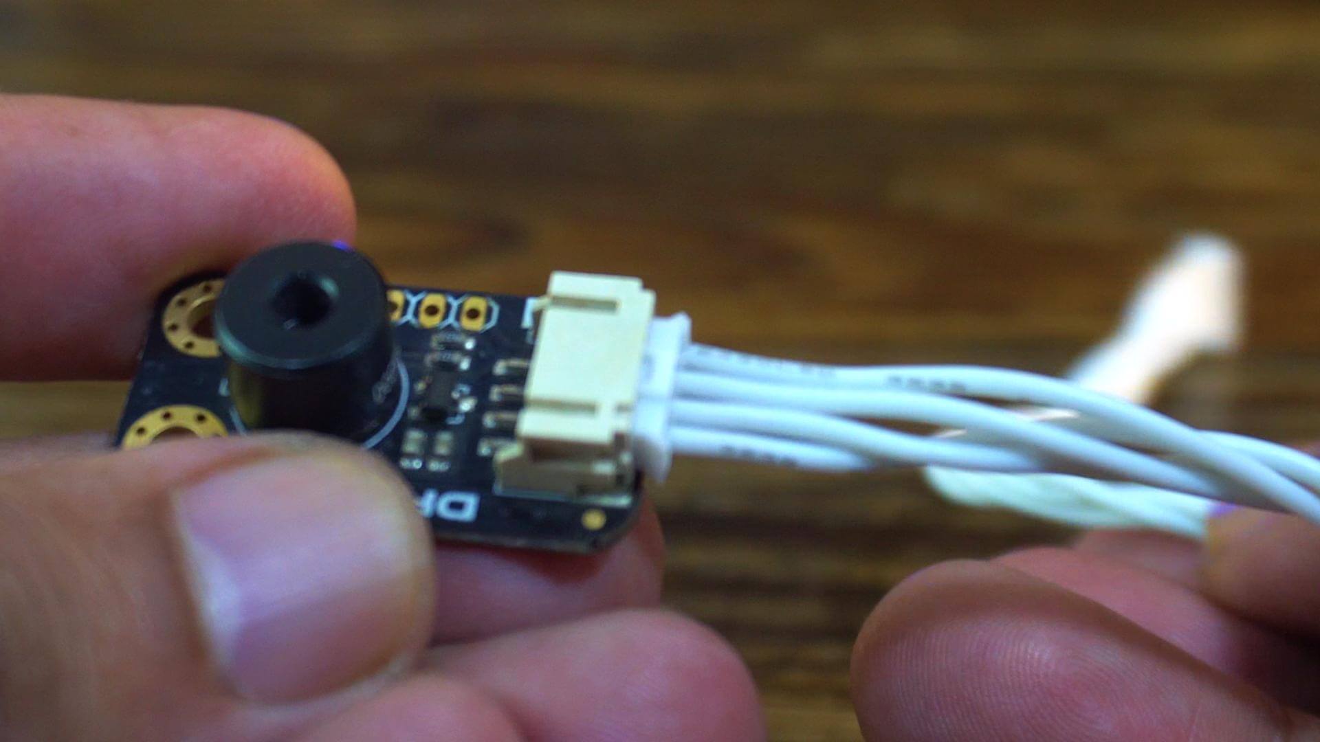 MLX90614 non-contact infrared temperature sensor connected to the UNIHIKER M10