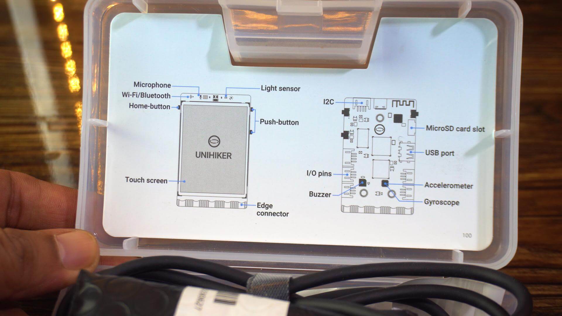 UNIHIKER M10 onboard components including touchscreen, sensors, microphone, buttons, buzzer, and LED