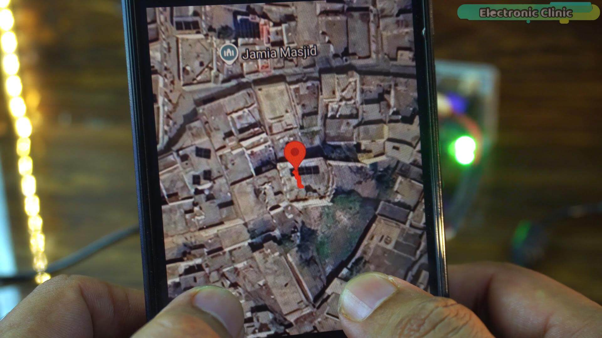 DIY ESP32 GPS tracker showing a detailed satellite map tile view